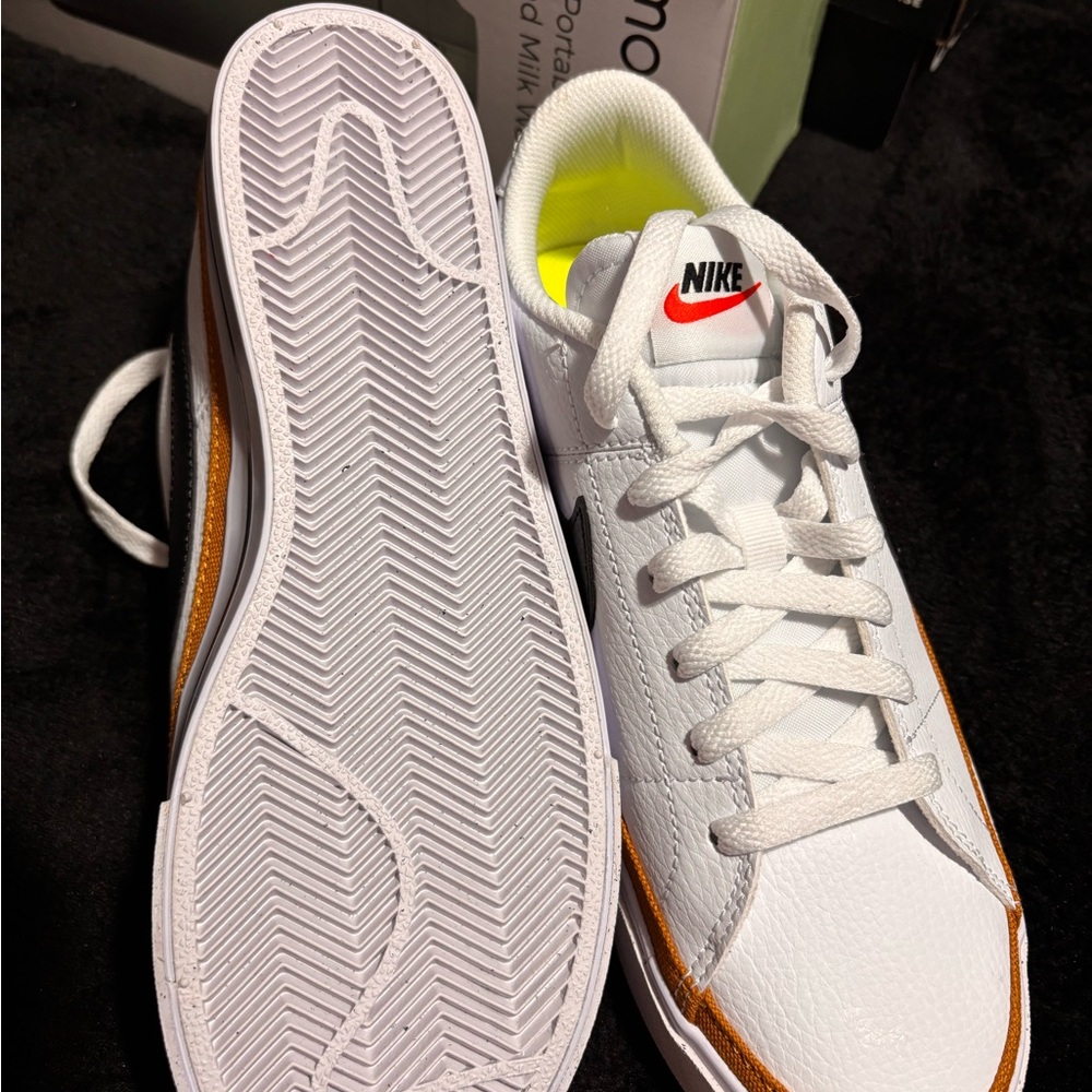 Nike White Low-Top Sneakers with Black Swoosh and Gold Accent - Picture 2 of 4